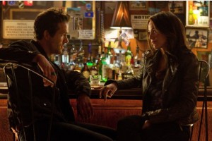 Ryan Reynolds as Hal Jordan and Blake Lively as Carol Ferris