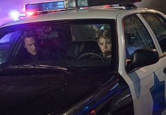 Missing prisoner Cal Sweeney (guest star Eric Johnson) holds Rebecca (Jones) hostage.