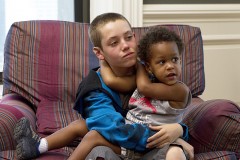 Carl takes care of Liam at their new foster home.