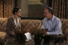 Elizabeth, portraying an American, assesses just how nervous Dorwin is.