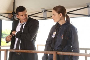 While at a crime scene, Brennan (Emily Deschanel, R) tells Booth (David Boreanaz, L) she's been trying to reach him..."Christine wanted to talk to her daddy."