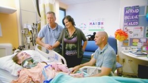 17 year old Abby Marsh with her family by her bedside