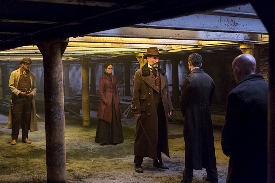 L-R: Ethan (Josh Hartnett) follows Vanessa (Eva Green) and Sir Malcom (Timothy Dalton) beneath the opium house where dark creatures lurk.