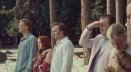 The entire group watches Chad row out to the middle of the lake.