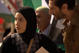 Fauzi tries to talk Samira into leaving the square