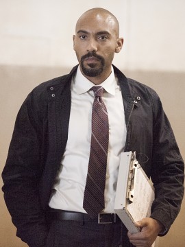 Hank Wonham (Alex LanTpekun) watches as the Taliban prisoners are released into his care.