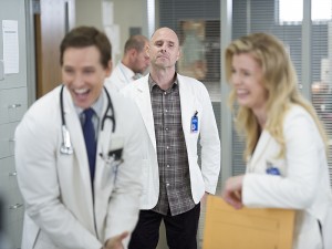 Coop and Carrie get carried away while Eddie looks on disapprovingly.