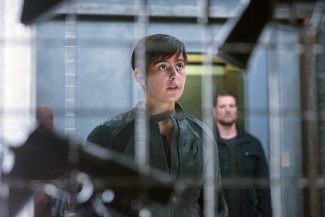Isn't Trubel's room...cozy? Nothing says 'home' like automatic weapons hanging on the wall.