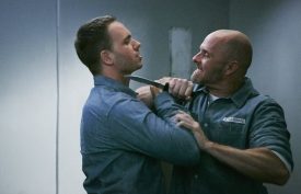 SUITS -- "The Hand That Feeds You" Episode 609 -- Pictured: (l-r) Patrick J. Adams as Michael Ross, Paul Schulze as Frank Gallo -- (Photo by: Ian Watson/USA Network)