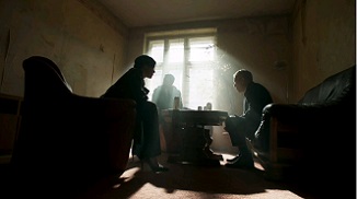 Valerie Edwards, with Daniel in the background, inform one of their own he's been compromised. Photos ©2016 EPIX. All Rights Reserved.